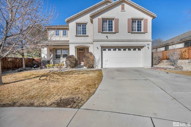 view of front property with a garage and a front lawn