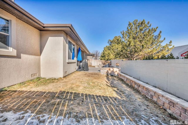 view of yard with a fenced backyard