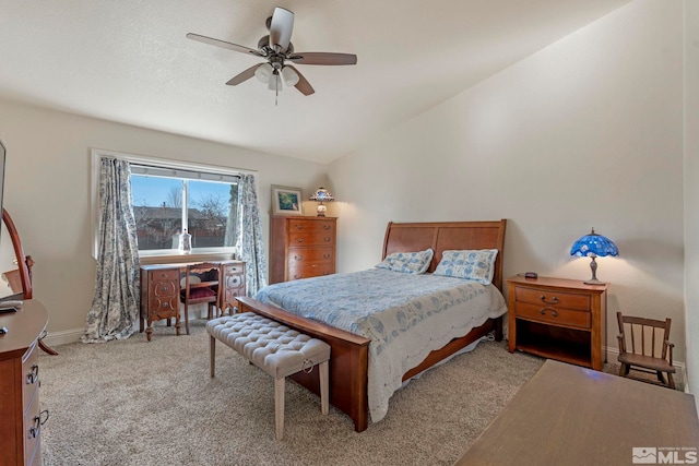 carpeted bedroom featuring lofted ceiling and ceiling fan