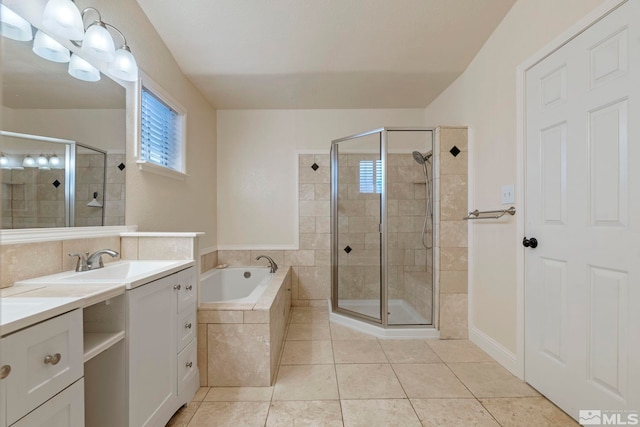 bathroom with tile patterned flooring, plus walk in shower, and vanity