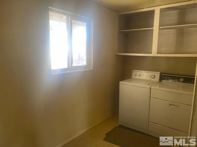 clothes washing area with washing machine and clothes dryer