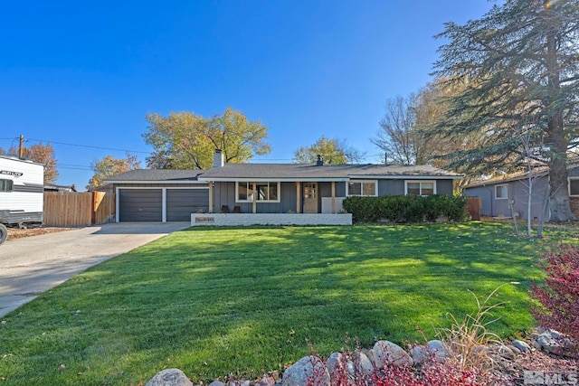 ranch-style house featuring a garage and a front lawn