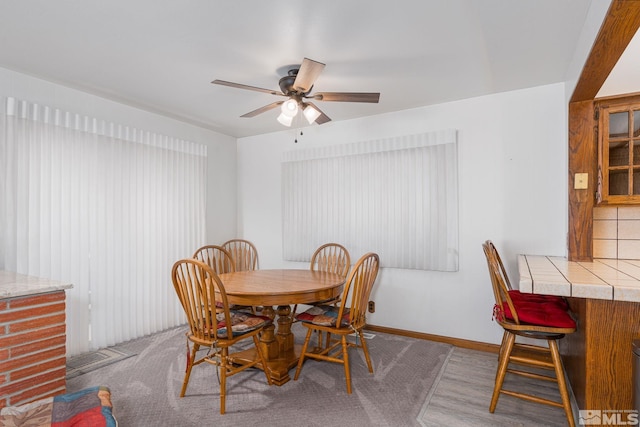 dining space with ceiling fan