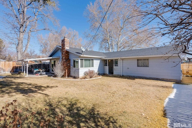 single story home with a carport and a front yard