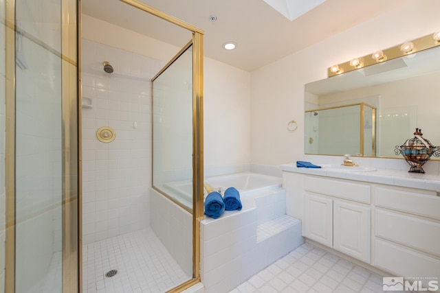 bathroom featuring plus walk in shower and vanity