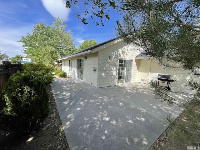 view of property exterior featuring a patio