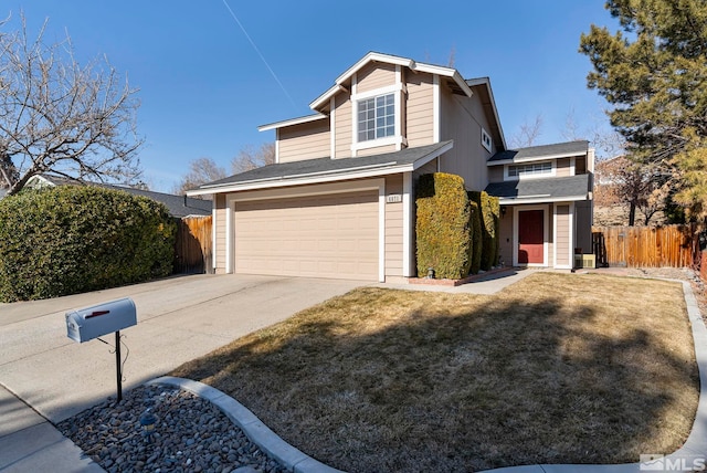 view of front facade with a garage and a front yard