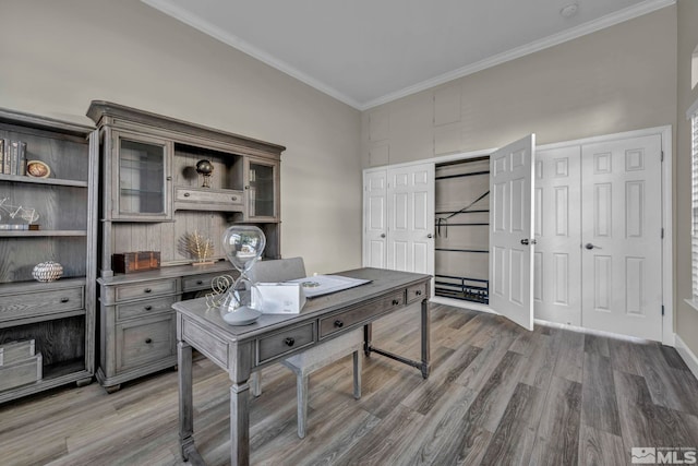 home office featuring ornamental molding and dark hardwood / wood-style flooring