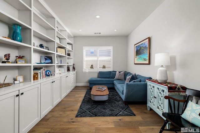 living room featuring dark wood-type flooring