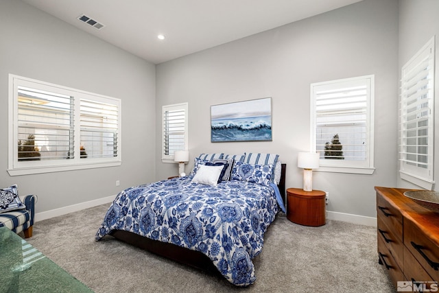 bedroom featuring light colored carpet