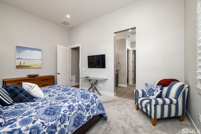 bedroom featuring light carpet