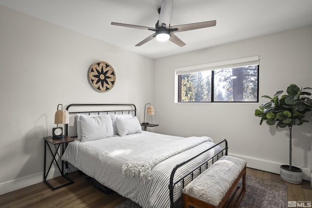 bedroom with ceiling fan and dark hardwood / wood-style floors