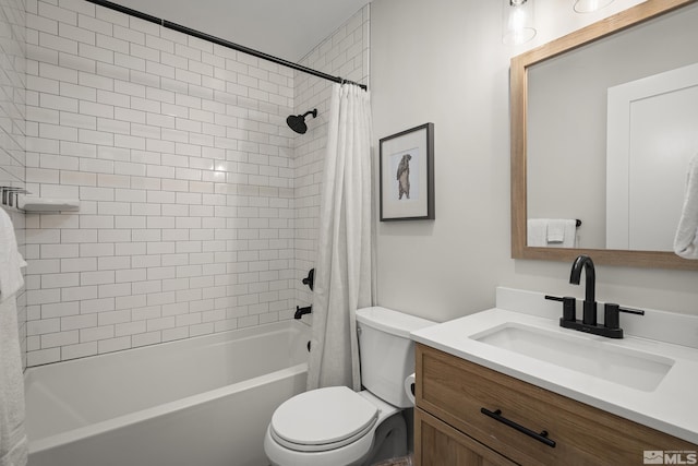 full bathroom with vanity, shower / bath combo, and toilet