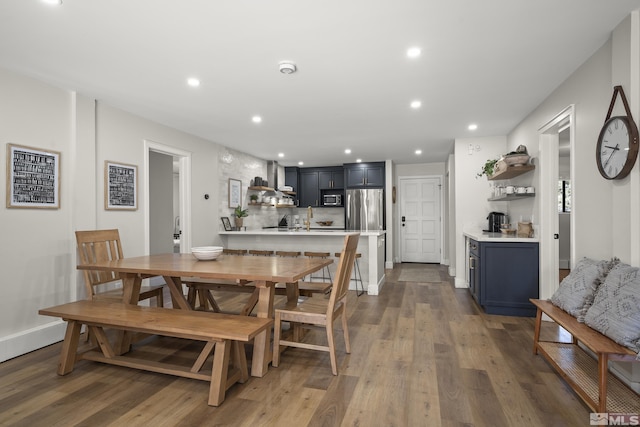 dining room with wood-type flooring