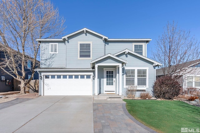 view of property featuring a garage and a front yard