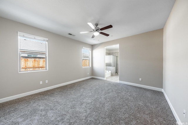 carpeted empty room with ceiling fan