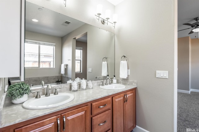 bathroom featuring ceiling fan and vanity