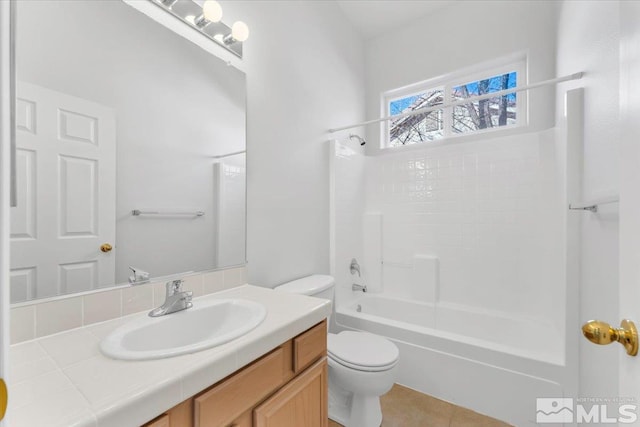 full bathroom featuring shower / tub combination, vanity, and toilet