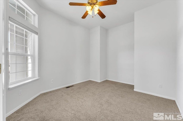 carpeted empty room with ceiling fan