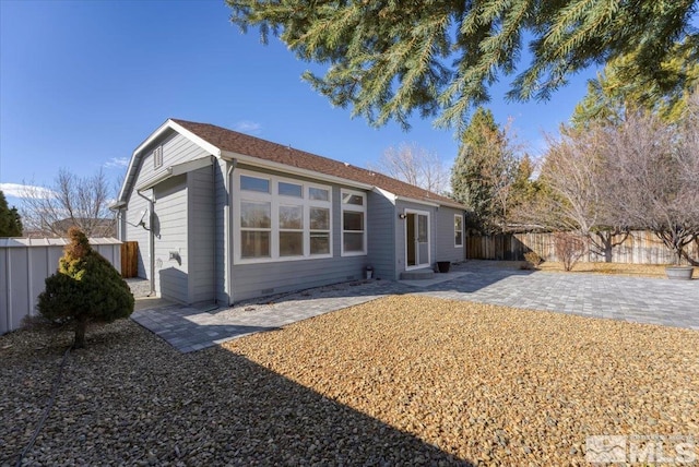 back of property with a patio area