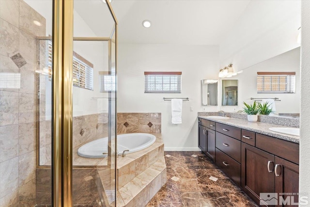 bathroom featuring independent shower and bath and vanity