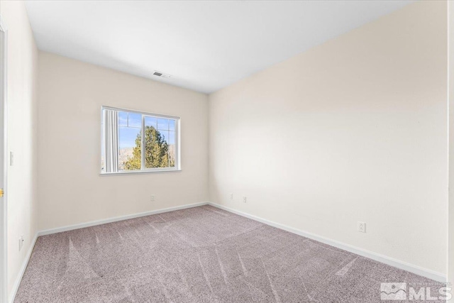 empty room featuring carpet floors