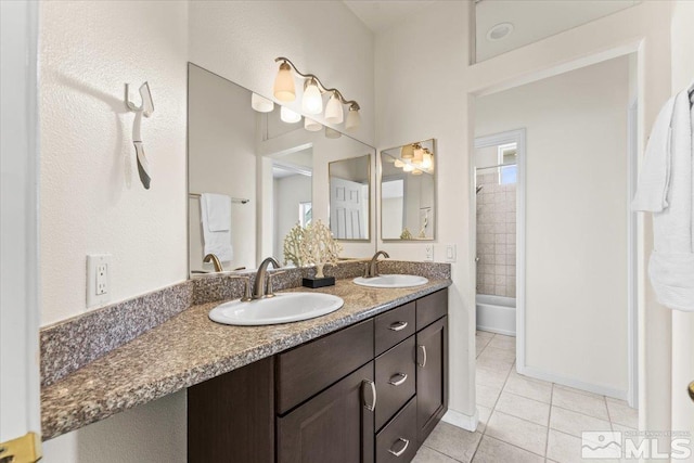 bathroom with tile patterned floors and vanity