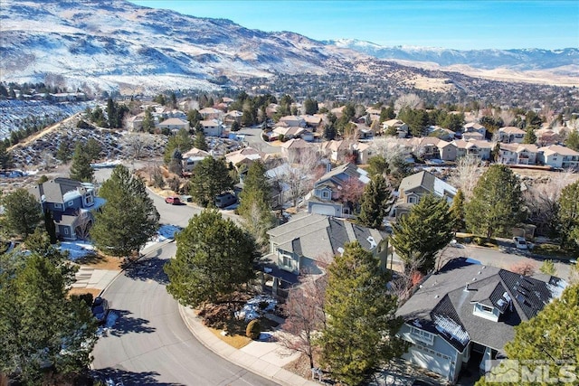 birds eye view of property featuring a mountain view