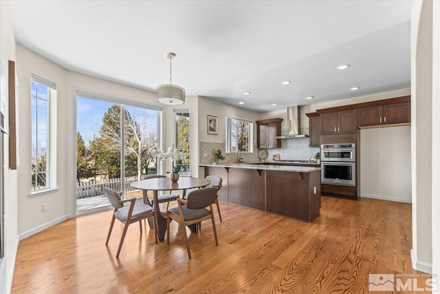 dining room featuring light hardwood / wood-style floors