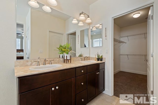 bathroom with vanity, tile patterned flooring, and ceiling fan