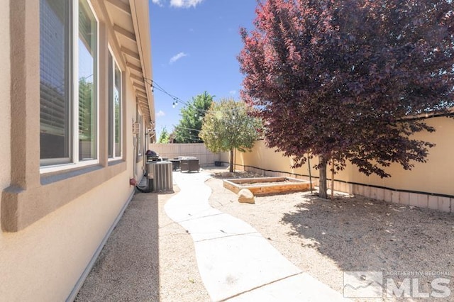 view of patio / terrace with central AC unit