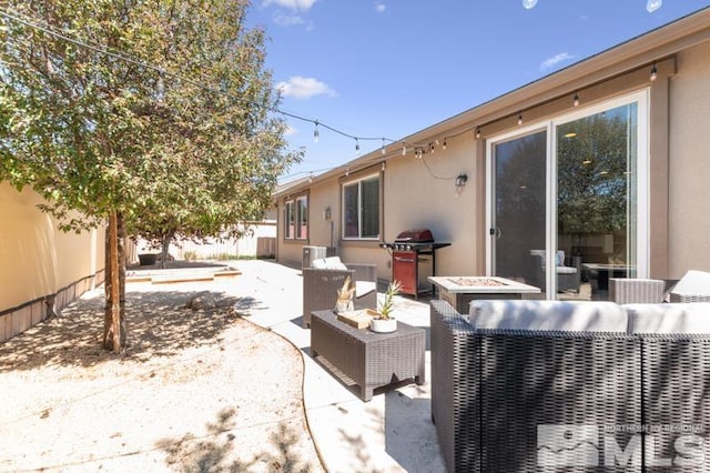 view of patio / terrace featuring a grill and an outdoor hangout area