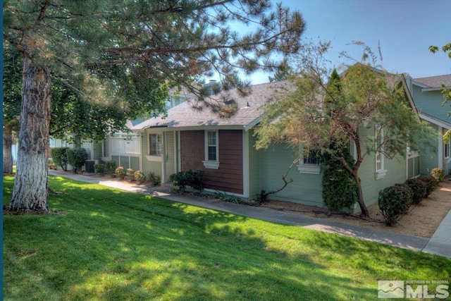 view of property exterior with a lawn