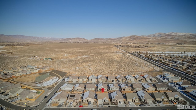 birds eye view of property featuring a mountain view