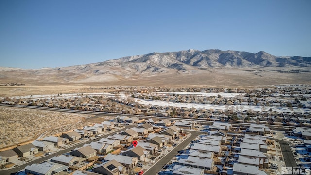 birds eye view of property with a mountain view