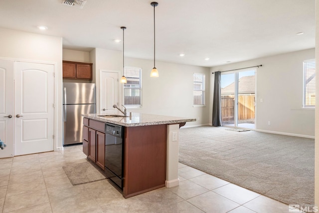 kitchen featuring dishwasher, stainless steel fridge, hanging light fixtures, a kitchen island with sink, and light carpet