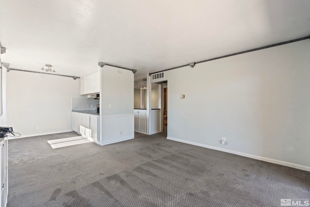 unfurnished living room featuring carpet flooring