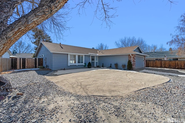 ranch-style home with a garage