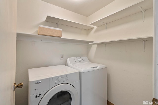 laundry room with washer and dryer