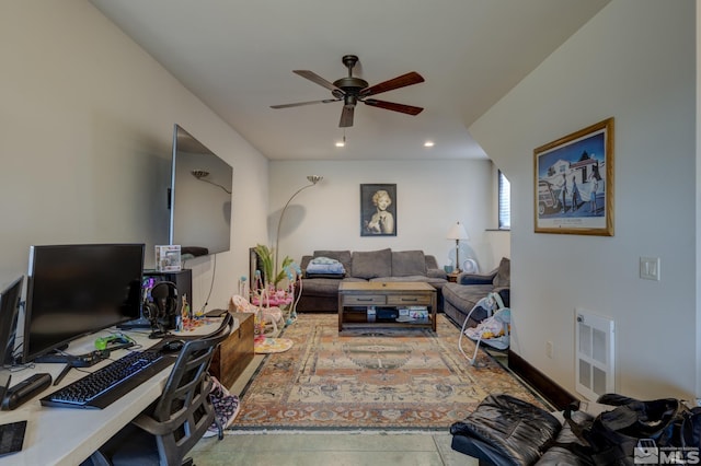 living room featuring ceiling fan and heating unit