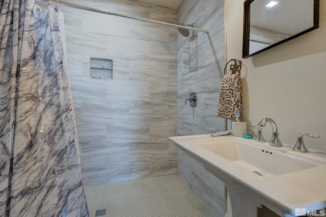 bathroom featuring sink and walk in shower