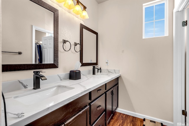 bathroom featuring hardwood / wood-style flooring and vanity