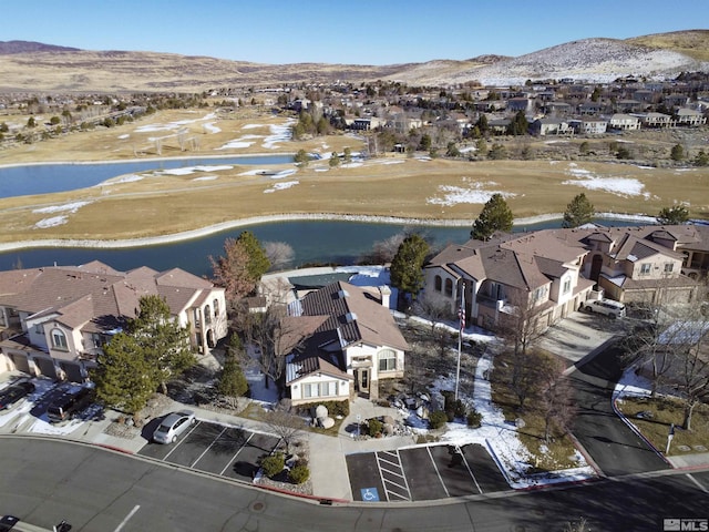 bird's eye view featuring a water and mountain view