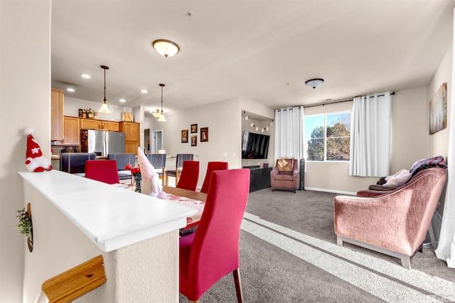 view of carpeted dining space