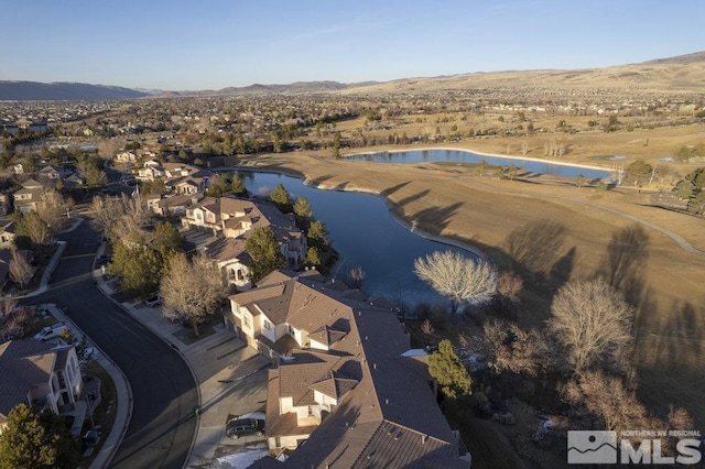 bird's eye view with a water and mountain view