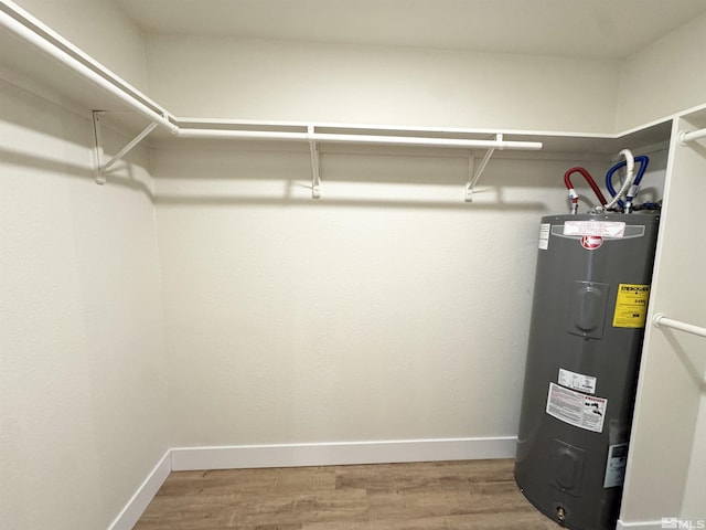 utility room with electric water heater