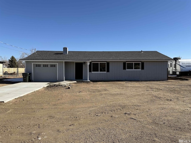 ranch-style home featuring a garage