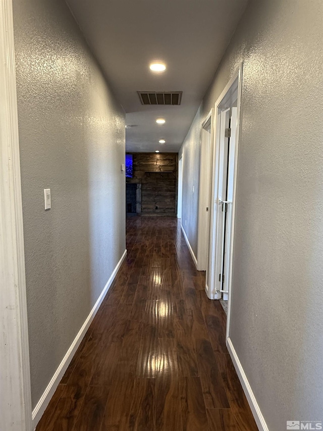 hall with dark hardwood / wood-style floors