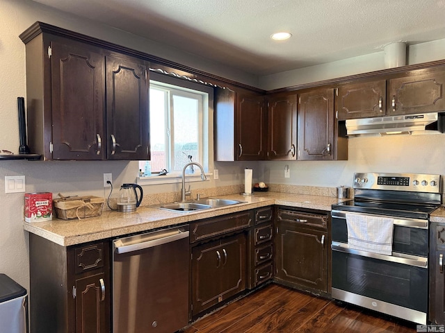 kitchen with dark brown cabinetry, appliances with stainless steel finishes, and sink