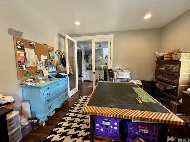 game room with french doors and dark hardwood / wood-style flooring